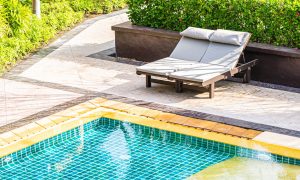Top of view outdoor swimming pool in resort hotel for leisure relax